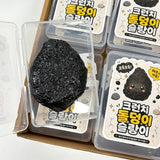Open Charcoal Stone Crunch Squishy Slime inside a clear storage box placed in a multi-pack retail box, showcasing the unique volcanic rock design for fidget toy collectors and Christmas gifts