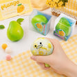 Hands squeezing a green Crunchy Mango Squishy Toy producing crisp ASMR crackle sound, featuring flexible TPR shell, color-changing chameleon effect, perfect Christmas gift and holiday stocking stuffer idea