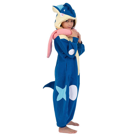 Official Pokémon Greninja Kids Costume Kigurumi Onesie Jumpsuit worn by a young model holding the hooded ears. Features a soft blue fleece body, cream chest panel, white knee spots, and a plush pink tongue scarf collar. Perfect for kids' Halloween costumes, cosplay party suits, sleepovers, and holiday gifts.