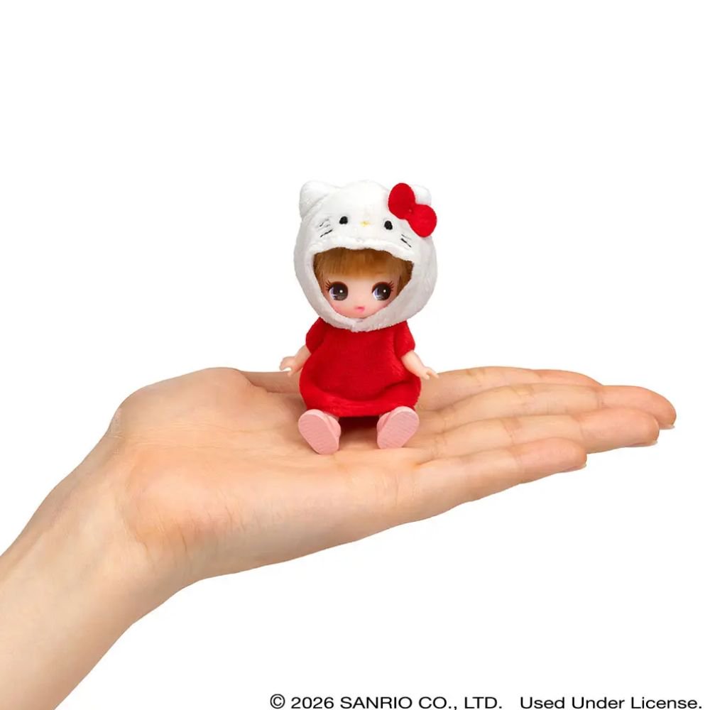 Hello Kitty Licca Petit Fashion Doll sitting on an open palm demonstrating mini pocket size, ideal stocking stuffer and cute holiday gift for Sanrio and Licca-chan fans