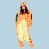 Person wearing a Charizard onesie against a light blue background