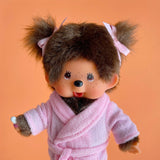 Official Licensed Monchhichi: Close-up of pink bathrobe doll with signature PVC face and soft fur, perfect as an authentic gift.