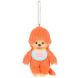 Plush monkey keychain with orange hair and a white face on a white background