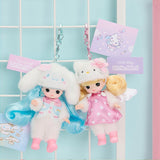 Two plush Little mimi x Sanrio keychains with dolls on a light blue grid background