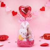 Official Miffy Valentine's Day Plush Gift Set in a clear ribbon package with a heart balloon. Includes a small yellow miffy holding a flower and a collectible figure stamp, sticker, and notepad perfect for Kawaii aesthetic Valentine's Day gift ideas