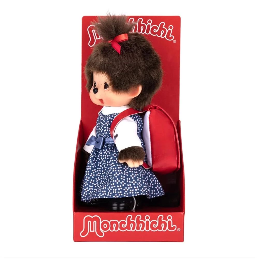 Officially Licensed Sekiguchi Monchhichi Japanese School Bag Girl 8 Inch Plush Doll in original red display box, wearing blue floral dress and carrying red Randoseru school backpack, perfect Christmas gift and holiday present for Monchhichi collectors