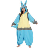 Official Pokémon Lucario Costume Kigurumi Onesie Jumpsuit worn by a smiling model holding the hooded ears. Features a soft blue, grey, and cream-yellow fleece body with a white chest spike detail and red character eyes. A cool cosplay outfit for Halloween costumes, cozy sleepover nights, and year-end holiday party loungewear for adult Pokémon fans.