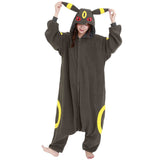 Official Pokémon Umbreon Costume Kigurumi Onesie Jumpsuit worn by a model holding the hooded ears. Features a soft black fleece body with yellow oval patterns and red character eyes. An ideal cosplay outfit for Halloween costumes, cozy sleepover nights, and year-end holiday party loungewear for adult Pokémon fans.