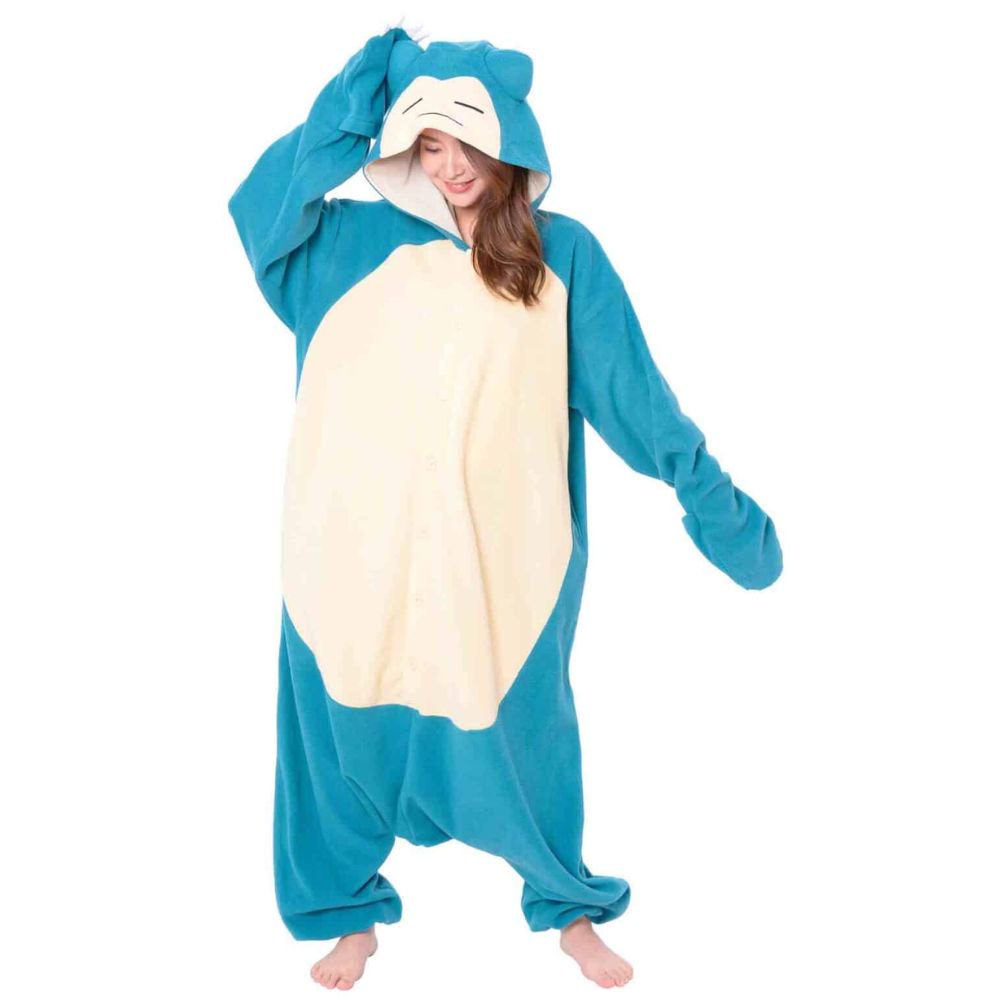 Model posing in Pokémon Snorlax Fleece Kigurumi Onesie adjusting Snorlax hood with ears, ultra-warm fleece adult winter pajamas and cozy unisex lounge wear, ideal holiday present and warm Christmas loungewear