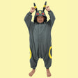 Front view of Officially Licensed Pokémon Umbreon Kids Fleece Kigurumi Onesie Jumpsuit featuring dark grey cozy winter pajamas with red eyes hood face, pointed ears, and yellow rings, perfect Halloween costume, Christmas gift, warm kids sleepwear, and anime cosplay outfit