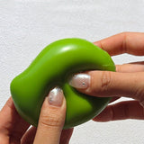 Squeezing open a green Sugar Mango Crunch Slime showing soft white stretchy slime filled with colorful crunch beads and yellow toppings inside, perfect Christmas gift and stress relief sensory toy