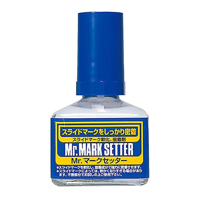Bottle of Mr. Mark Setter with blue cap and label on a white background. Mark setter Use Mr. Mark Softer and Mr. Mark Setter to apply dry transfer decals. 
