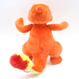 A plush toy of the Pokemon Charmeleon, predominantly orange with a yellow belly, official Nintendo branding.
